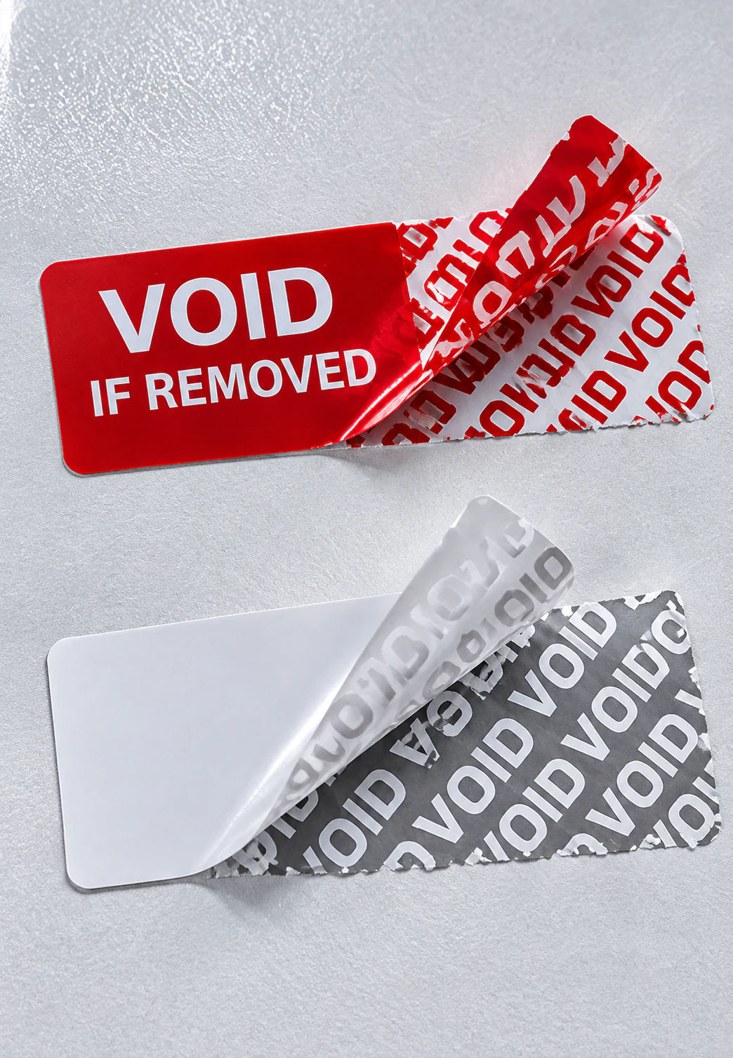 Adhesive seal samples showing transferred removal evidence and destructible-film fragments.